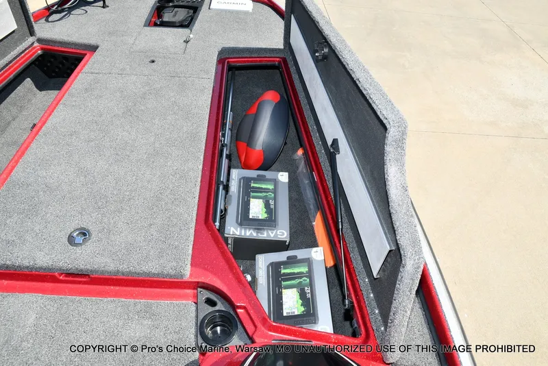 Slide: The Image of The image shows the storage compartment of a Nitro Z20 XL Pro boat with batteries and a life ring. - 49