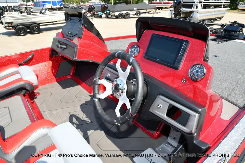 Slide: The Image of The image shows the cockpit of a Nitro Z20 XL Pro boat with a modern helm. - 24