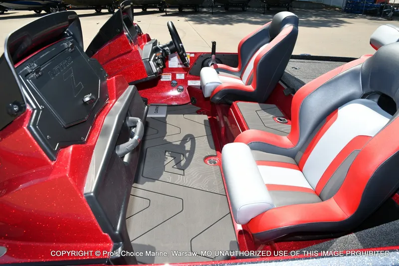 Slide: The Image of The image shows the cockpit of a Nitro Z20 XL Pro boat with red and gray seats. - 27