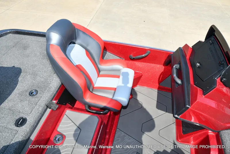 Slide: The Image of The image shows the driver's seat of a 2027 Nitro Z20 XL Pro boat with red and gray design. - 33