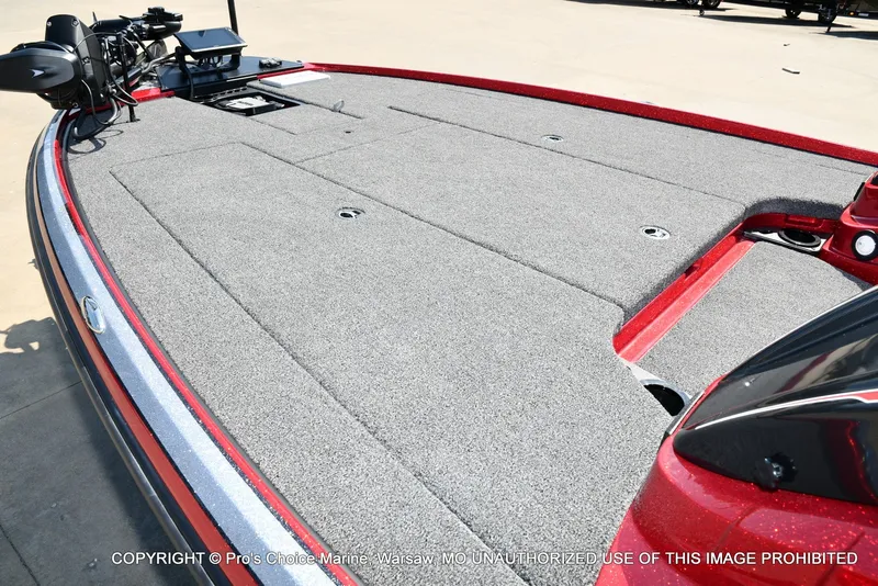 Slide: The Image of The image shows the deck of a 2027 Nitro Z20 XL Pro boat with gray carpeting. - 26