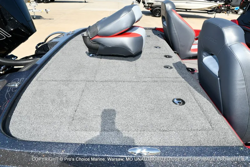 Slide: The Image of The image shows the deck of a Nitro Z20 XL Pro boat with gray carpeting and two seats. - 23