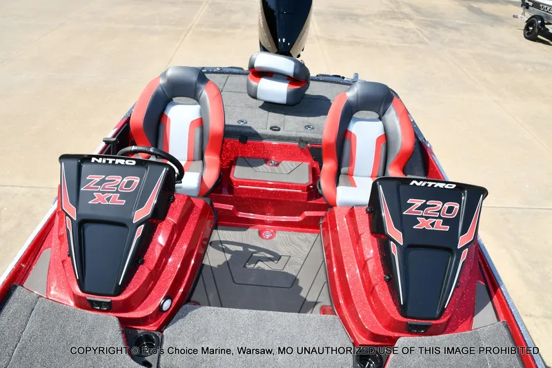 Slide: The Image of The image shows the cockpit of a Nitro Z20 XL Pro boat with two padded seats. - 38