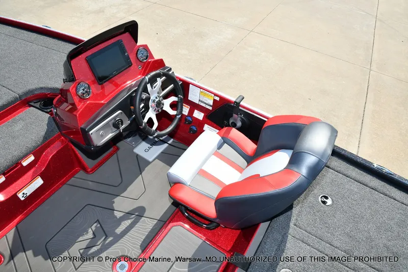 Slide: The Image of The image shows the cockpit of a Nitro Z20 XL Pro boat with a modern helm and cushioned seat. - 29