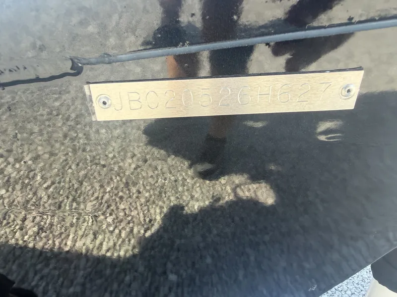 Slide: The Image of Close-up of a serial number on a boat hull. - 4
