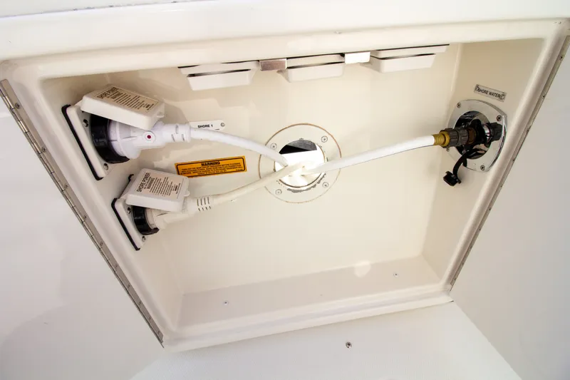 Slide: The Image of A connection area with cables and switches inside a boat. - 28