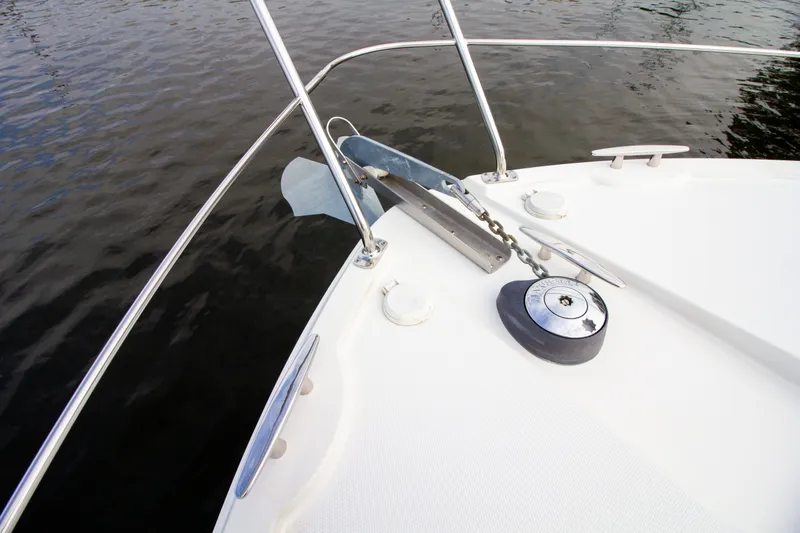 Slide: The Image of The bow view of a 2006 Carver 33 Super Sport shows anchor and railing. - 37