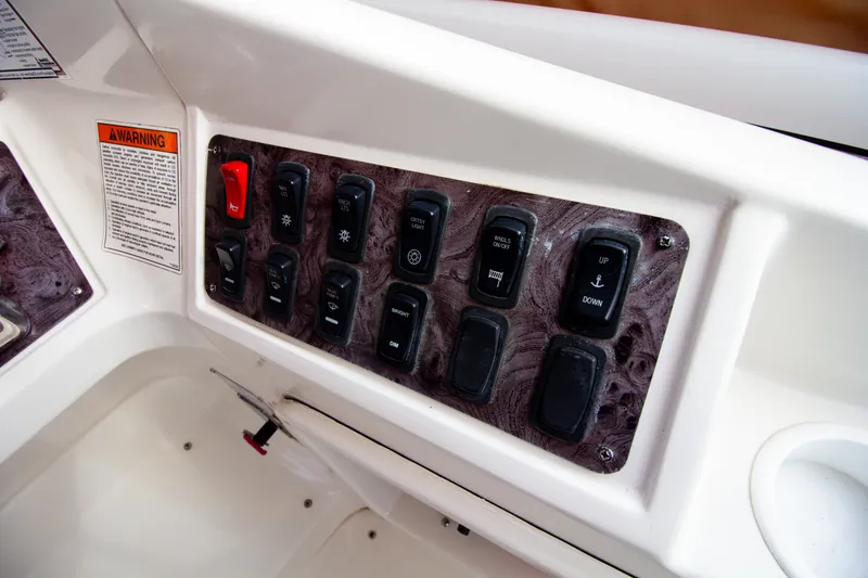 Slide: The Image of Close-up of a control panel with multiple switches and a warning label. - 43