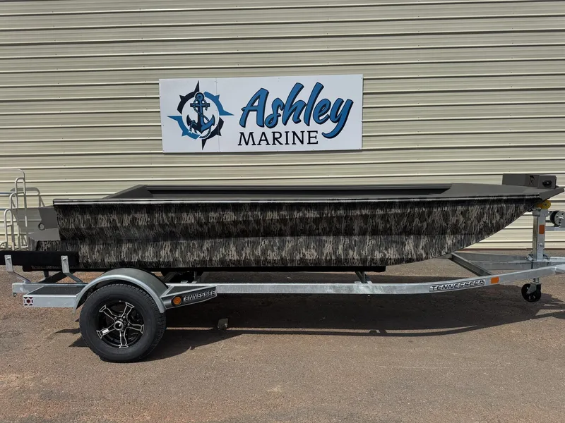 The Image of A 2026 Reaper Boats 656 Step Transom on a trailer in front of a building with an "Ashley Marine" sign. - 1