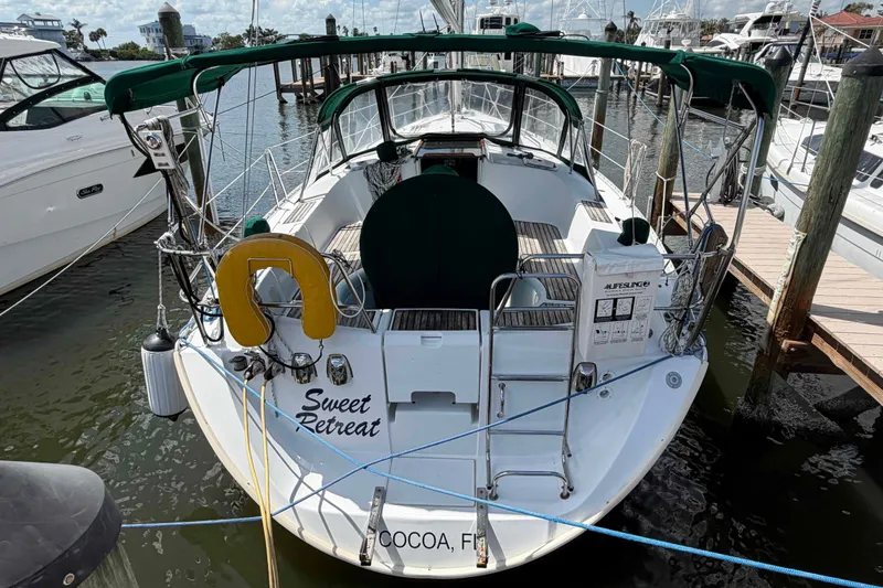 Slide: The Image of 2004 Beneteau 361 sailboat named "Sweet Retreat" docked in Cocoa, Florida marina. - 25
