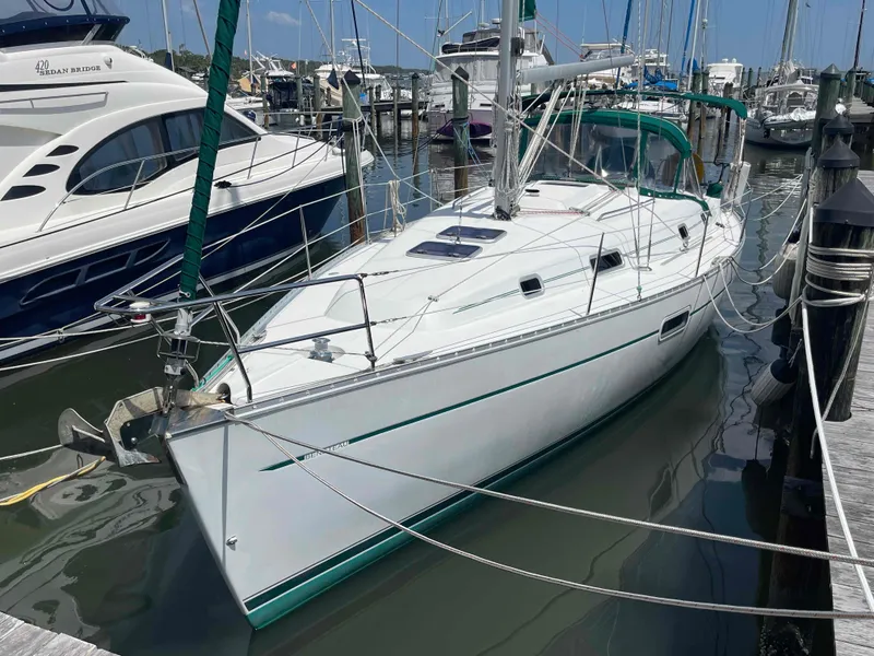 Slide: The Image of Sailboat Beneteau 361, 2004 model, docked at marina with other boats. - 1