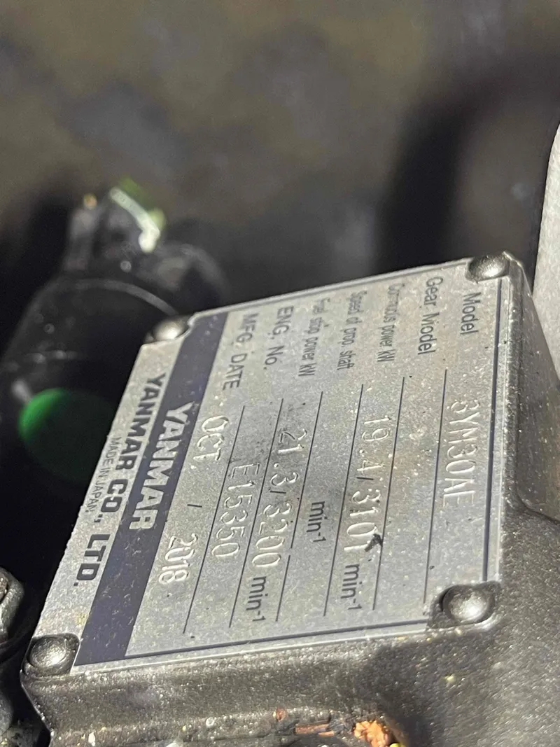Slide: The Image of Yanmar engine plate on a 2004 Beneteau 361 sailboat, model 3YM30AE. - 52
