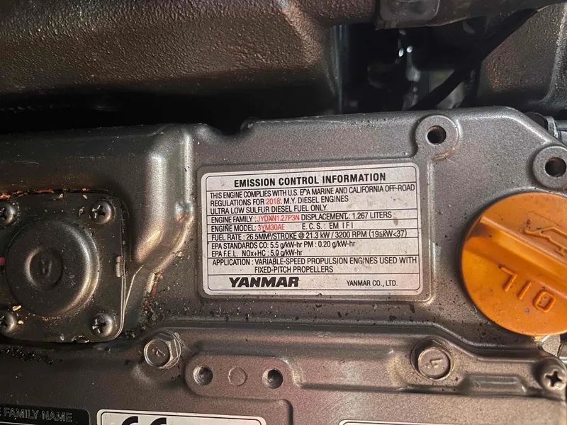 Slide: The Image of Yanmar engine emission control label on a 2004 Beneteau 361 sailboat. - 53