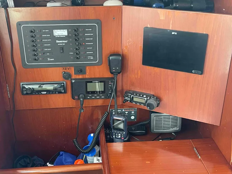 Slide: The Image of Control panel of a 2004 Beneteau 361 sailboat with navigation and communication equipment. - 44