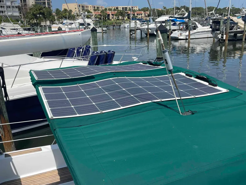 Slide: The Image of Sailboat with solar panels on deck, docked in marina. Beneteau 361, 2004 model. - 35