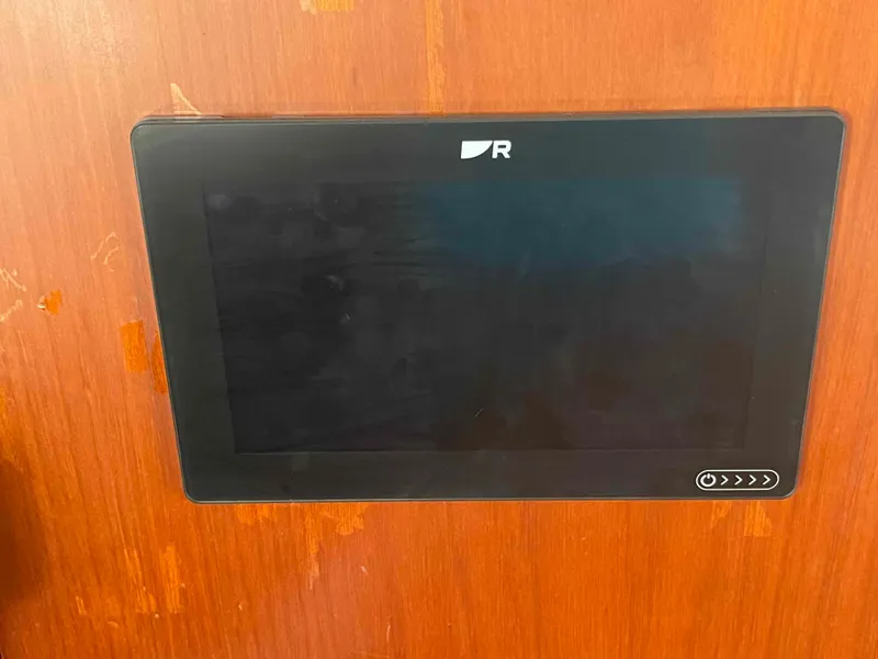 Slide: The Image of Control panel on a 2004 Beneteau 361 yacht, mounted on a wooden surface. - 46