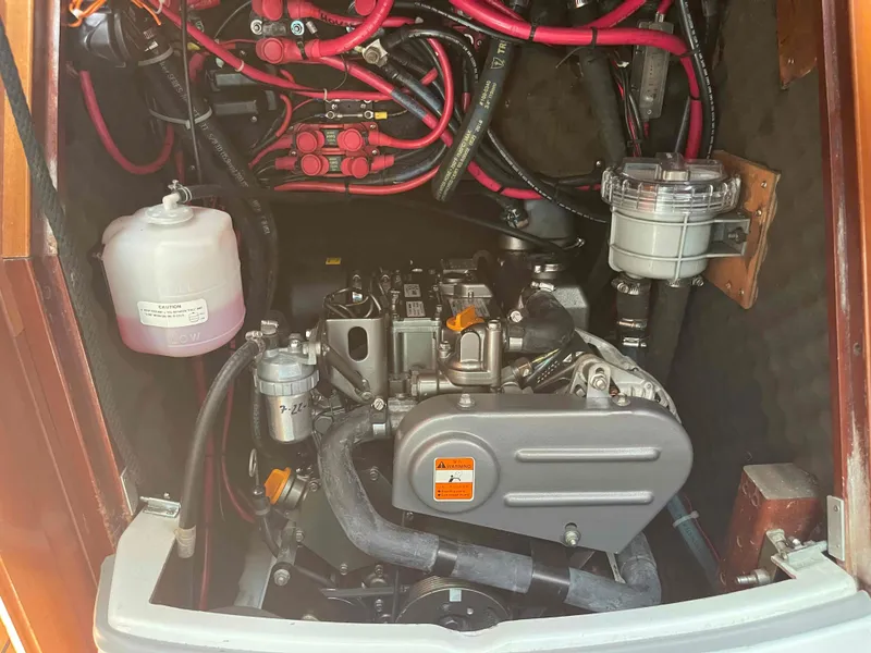 Slide: The Image of Engine compartment of a 2004 Beneteau 361 sailboat, showing wiring and components. - 10