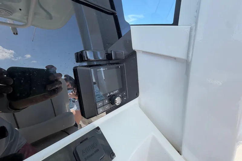 Slide: The Image of JL Audio system on 2022 Sea Hunt Ultra 239SE boat dashboard. - 23