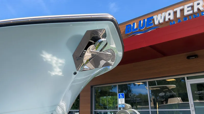 The Image of The 2027 Scout 260 LXF is parked in front of a building with a "Bluewater Marine" sign. - 1