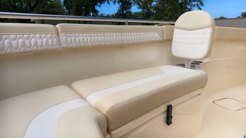 Slide: The Image of The 2027 Scout 260 LXF features an elegant, cream-colored bench seat with textured details. - 16