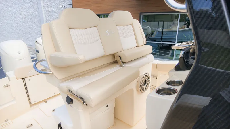 Slide: The Image of The 2027 Scout 260 LXF features luxurious beige upholstered seats with integrated cup holders. - 15