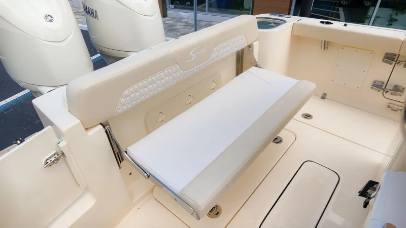 Slide: The Image of The 2027 Scout 260 LXF features an elegant beige fold-down seat in the aft area. - 10