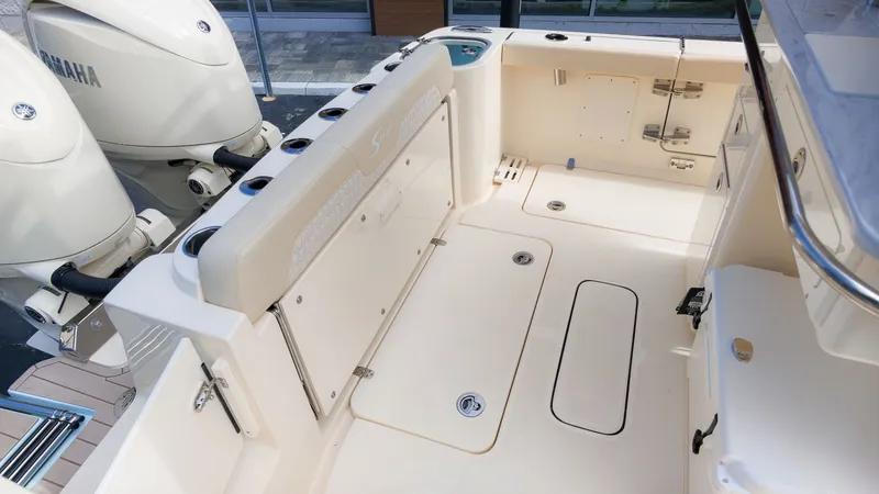 Slide: The Image of The image shows the cockpit of a Scout 260 LXF boat with two Yamaha engines. - 3