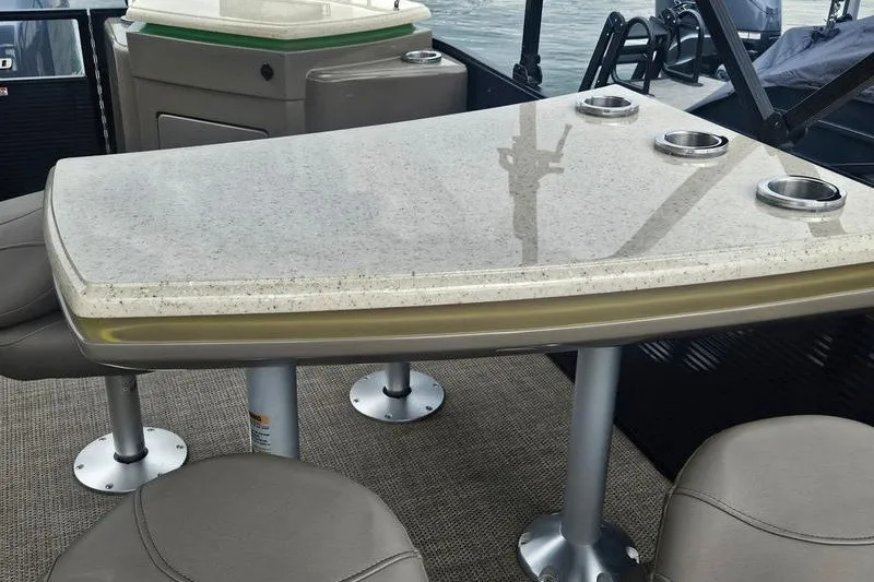 Slide: The Image of Luxurious interior of 2019 Bennington SX 23 SPDXP boat with sleek table and seating. - 11