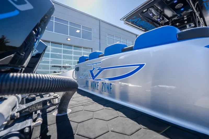 Slide: The Image of 2022 Statement 350 Open boat with "No Woke Zone" decal, blue seating, and modern design. - 16