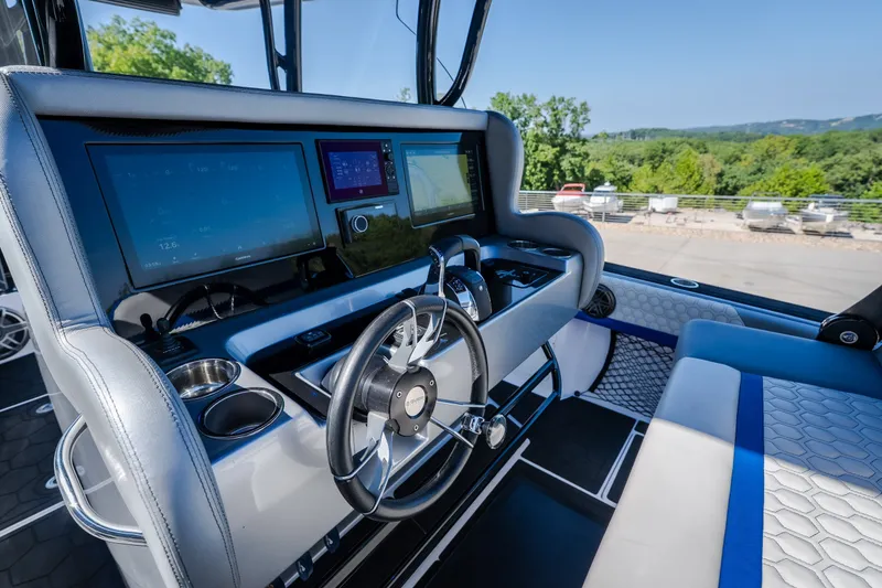 Slide: The Image of Cockpit of 2022 Statement 350 Open boat with advanced navigation displays and steering wheel. - 61