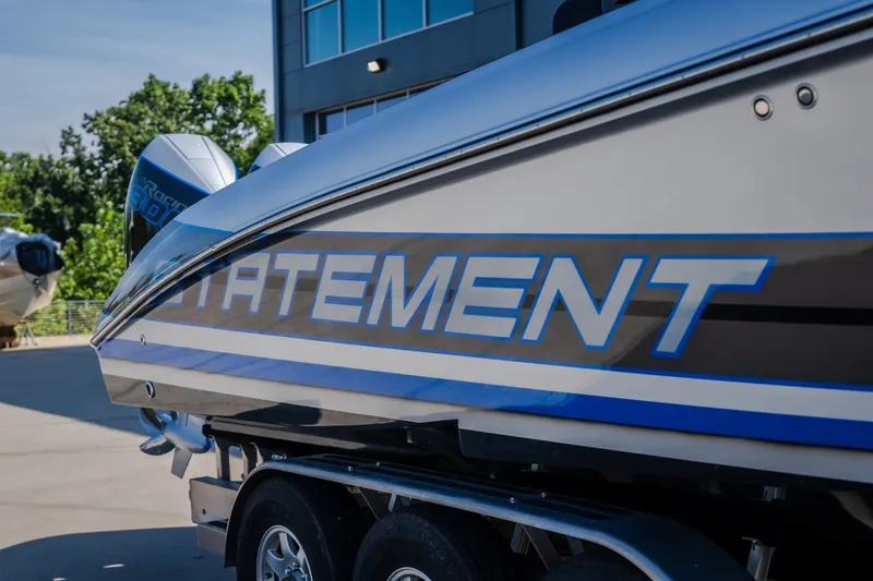Slide: The Image of 2022 Statement 350 Open boat on trailer, sleek design, outdoor setting. - 56