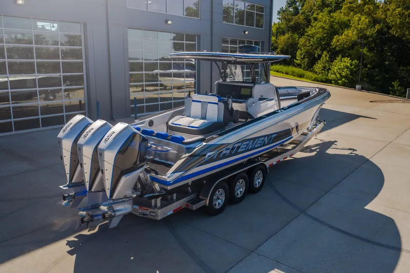 Slide: The Image of 2022 Statement 350 Open boat with triple outboard engines on a trailer. - 66
