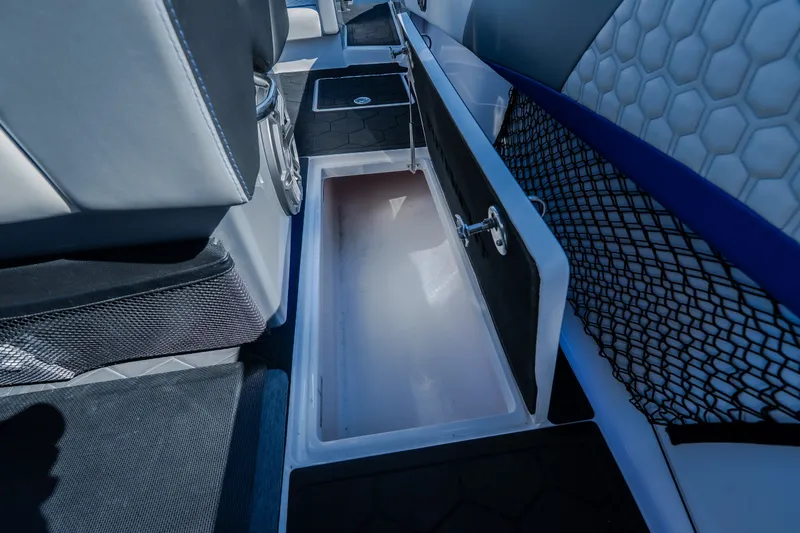 Slide: The Image of 2022 Statement 350 Open boat interior storage compartment with sleek design and netted side pocket. - 64