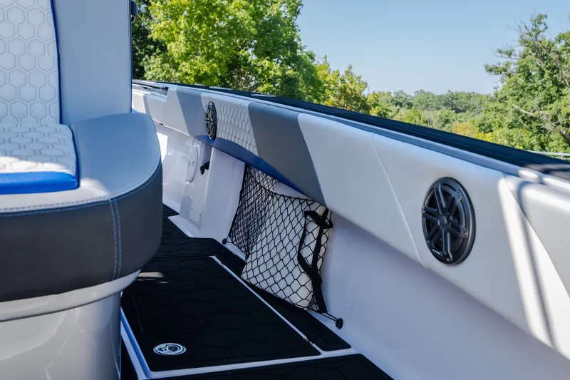 Slide: The Image of 2022 Statement 350 Open boat interior with seating, speakers, and storage net. - 21