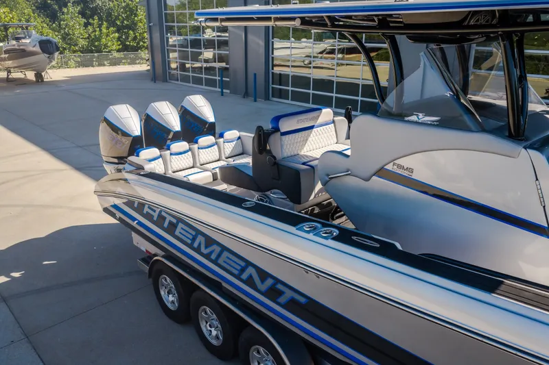 Slide: The Image of 2022 Statement 350 Open boat with quad engines, sleek design, and luxurious seating. - 49