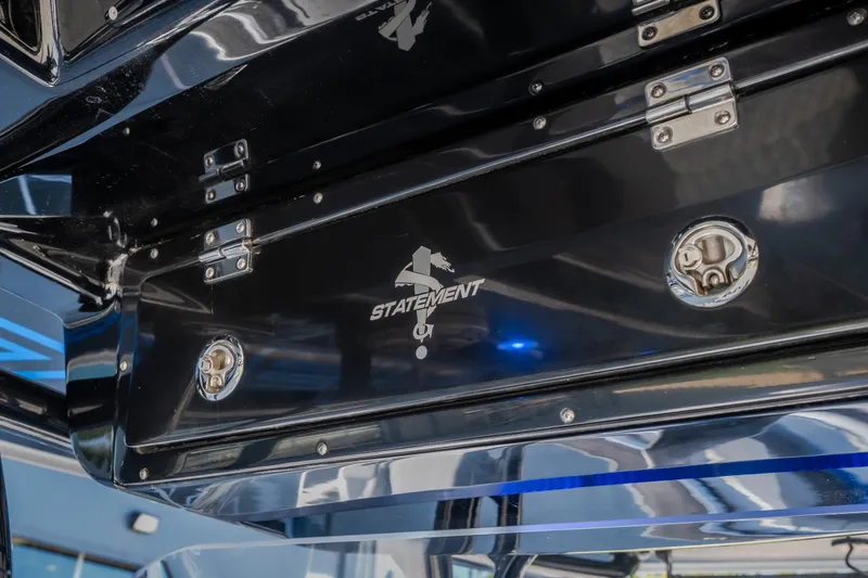Slide: The Image of 2022 Statement 350 Open boat detail with sleek black finish and secure latches. - 30