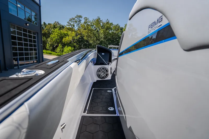 Slide: The Image of 2022 Statement 350 Open boat with sleek design and modern features, docked outdoors. - 42