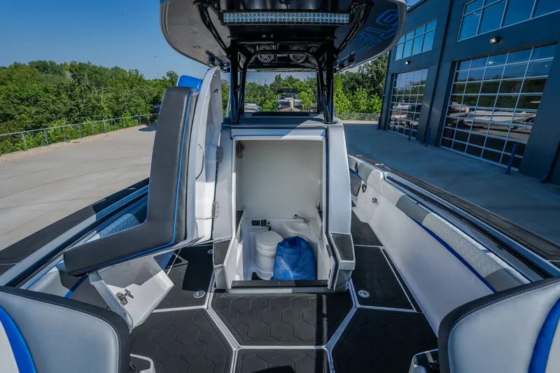 Slide: The Image of 2022 Statement 350 Open boat interior with seating and storage compartment. - 45