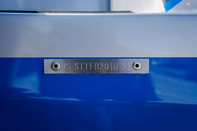 Slide: The Image of Hull identification number on a 2022 Statement 350 Open boat, displayed on a blue surface. - 54