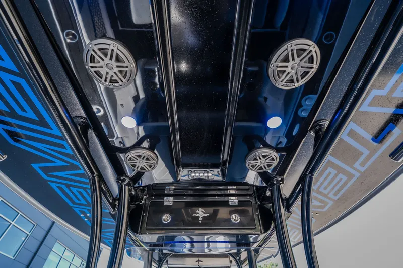 Slide: The Image of 2022 Statement 350 Open boat interior with speakers and sleek design elements. - 32