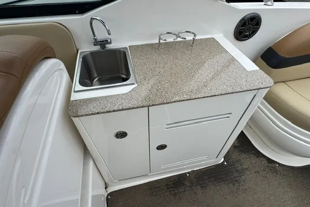 Slide: The Image of 2016 Sea Ray 300 SLX boat interior with sink and countertop. - 12
