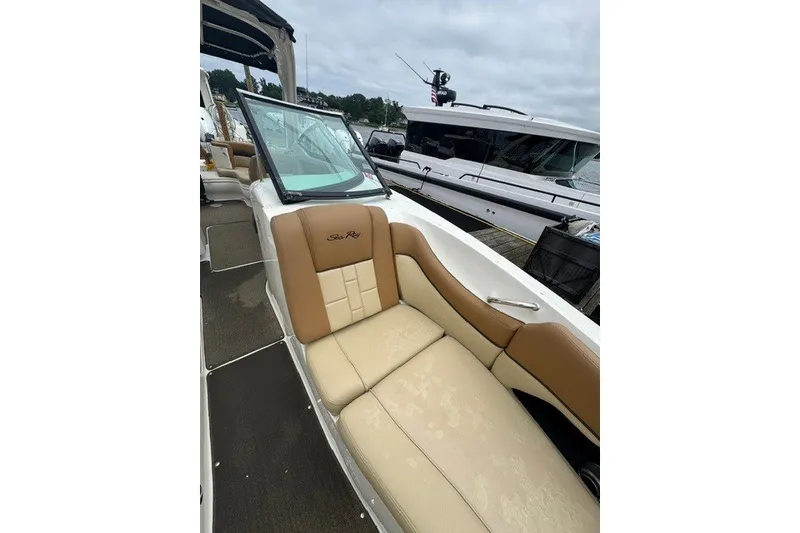 Slide: The Image of 2016 Sea Ray 300 SLX boat interior with tan seating and sleek design. - 25