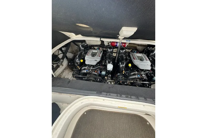 Slide: The Image of Engine compartment of a 2016 Sea Ray 300 SLX boat, showcasing dual engines. - 23