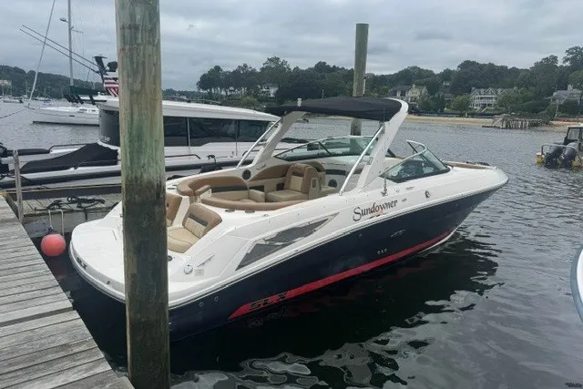 The Image of 2016 Sea Ray 300 SLX boat docked at marina, featuring sleek design and spacious seating. - 0