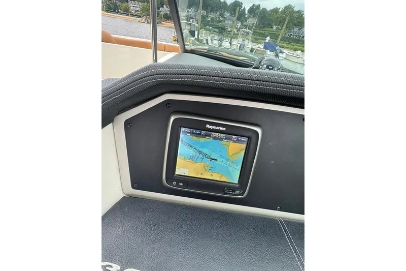 Slide: The Image of Raymarine navigation system on 2016 Sea Ray 300 SLX boat dashboard. - 29