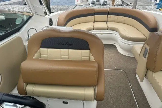 Slide: The Image of Interior of a 2016 Sea Ray 300 SLX boat with tan leather seating. - 16