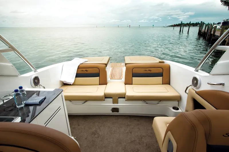 Slide: The Image of Manufacturer Provided Image: 2016 Sea Ray 300 SLX boat interior with tan seating and ocean view. - 6
