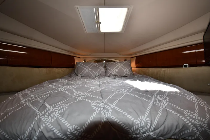Slide: The Image of Luxurious cabin interior of 2004 Sea Ray 360 Sundancer with cozy bedding. - 32