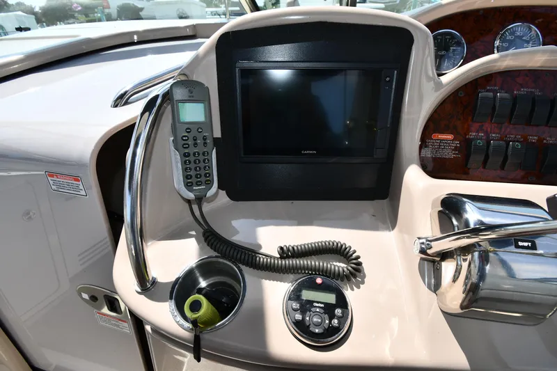 Slide: The Image of 2004 Sea Ray 360 Sundancer helm with navigation screen and controls. - 16
