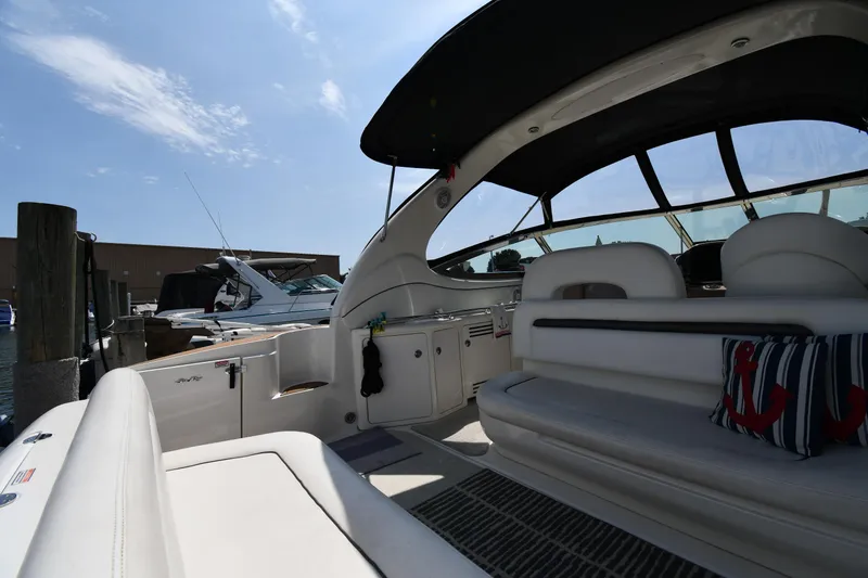 Slide: The Image of 2004 Sea Ray 360 Sundancer yacht interior with seating and nautical decor. - 22